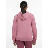 A soft pink lemieux nadine hoodie with long sleeves ribbed cuffs and a relaxed fit called nadine hoodie peony
