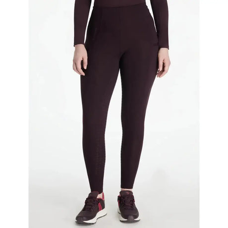 Dark burgundy high-waisted leggings with smooth stretchy fabric in lemieux naomi pull breeches damson style