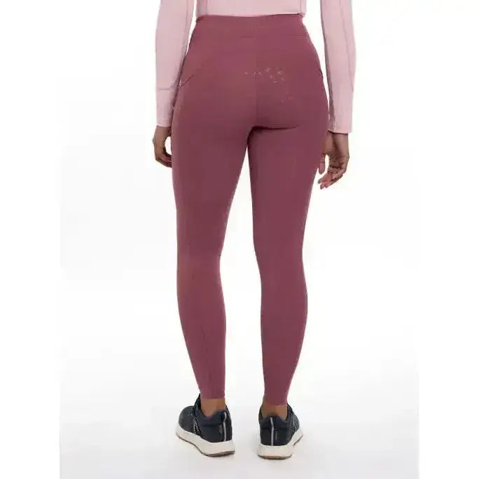 A back view of lemieux naomi pull high-waisted dusty rose leggings with subtle embroidery perfect for riding