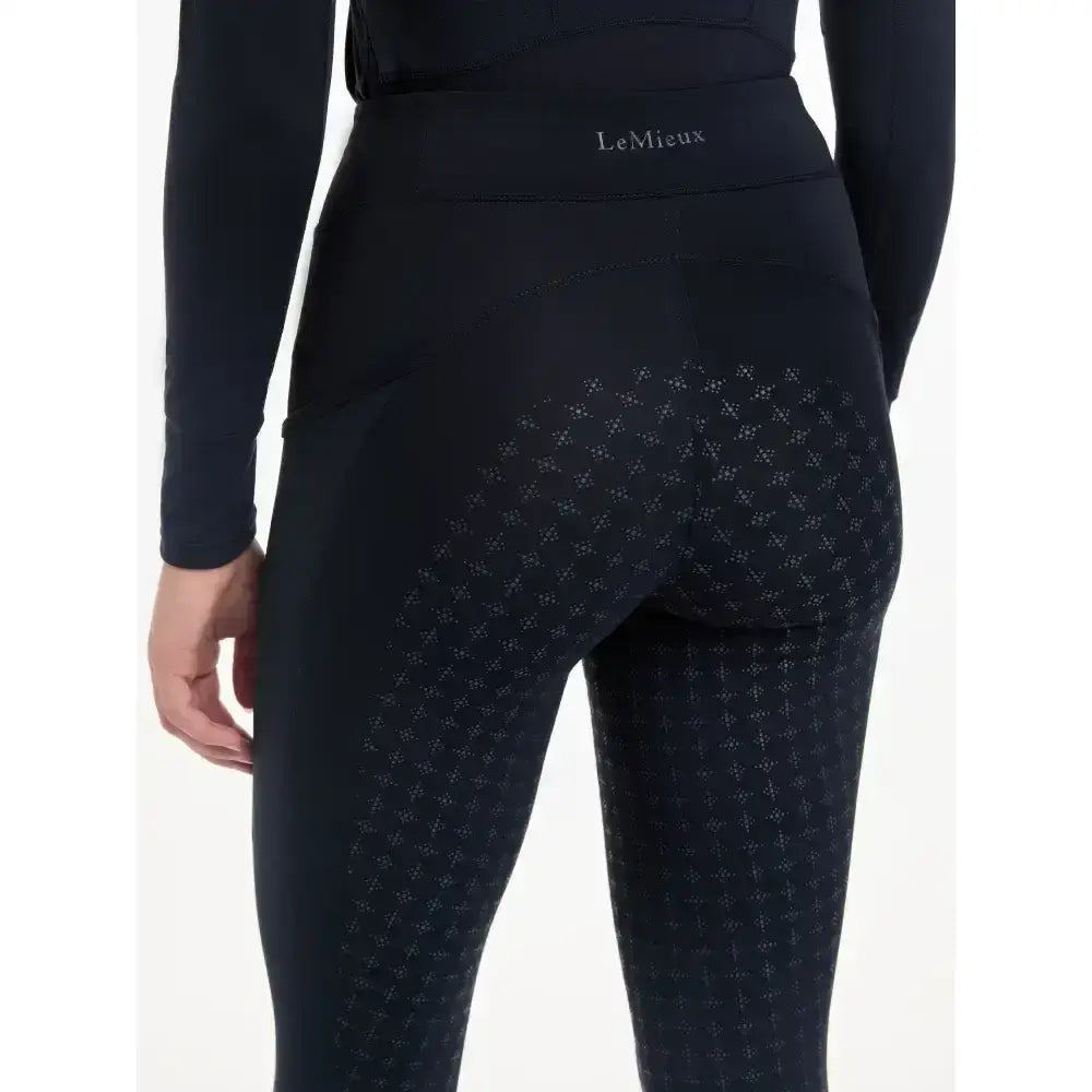 Back view of lemieux naomi pull navy leggings with subtle diamond texture and supportive elasticated waistband