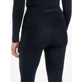 Back view of lemieux naomi pull navy leggings with subtle diamond texture and supportive elasticated waistband