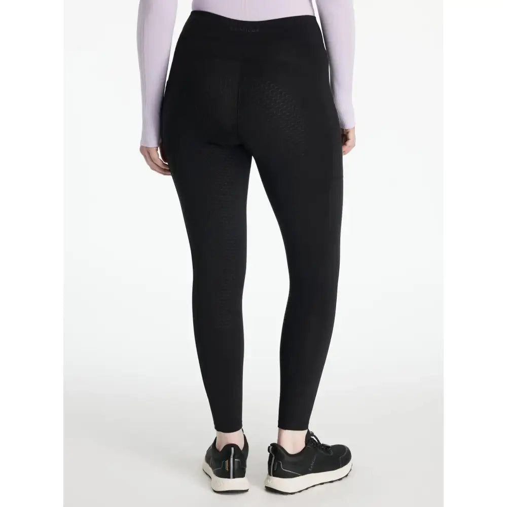 Black high-waisted leggings in smooth stretch fabric from lemieux natalie’s brush for a comfy fit and sleek look