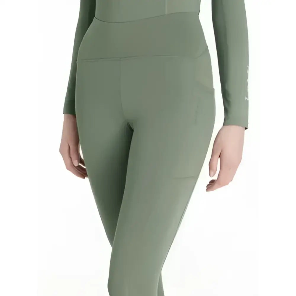 Olive green high waisted lemieux natalie brushed leggings with side pockets and sleek form fitting design