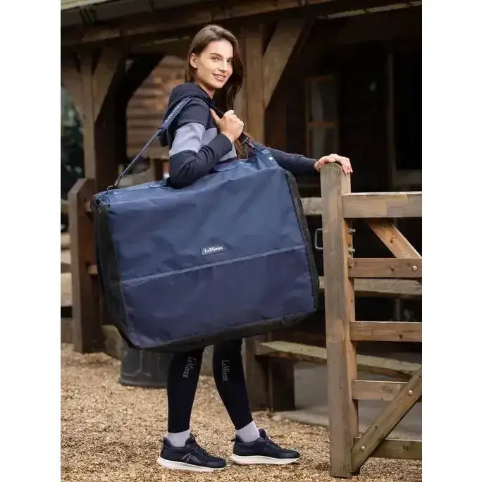 Navy blue durable fabric lemieux saddle pad carry bag with black trim and reinforced stitching for true lemieux aficionados