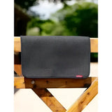 Black textured half pad square half pad with subtle perforated pattern and small red LeMieux logo on lower right corner