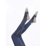 Navy blue lemieux performance socks dusk blue with beige and black striped accents on toes and heels