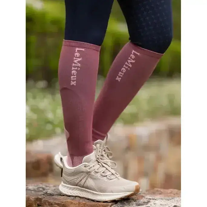 Maroon lemieux performance socks rosewood with subtle textured pattern and white embroidered brand logo for performance use