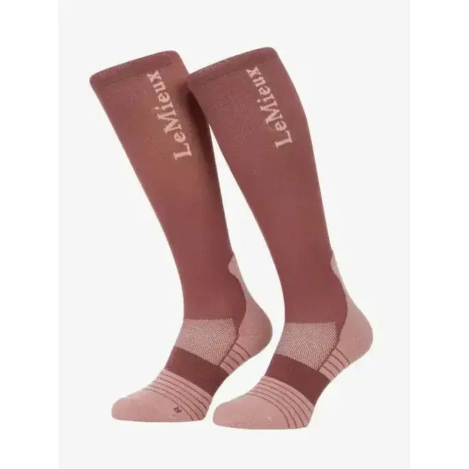 A pair of lemieux performance socks rosewood in maroon and light pink with textured knit and embroidered brand name