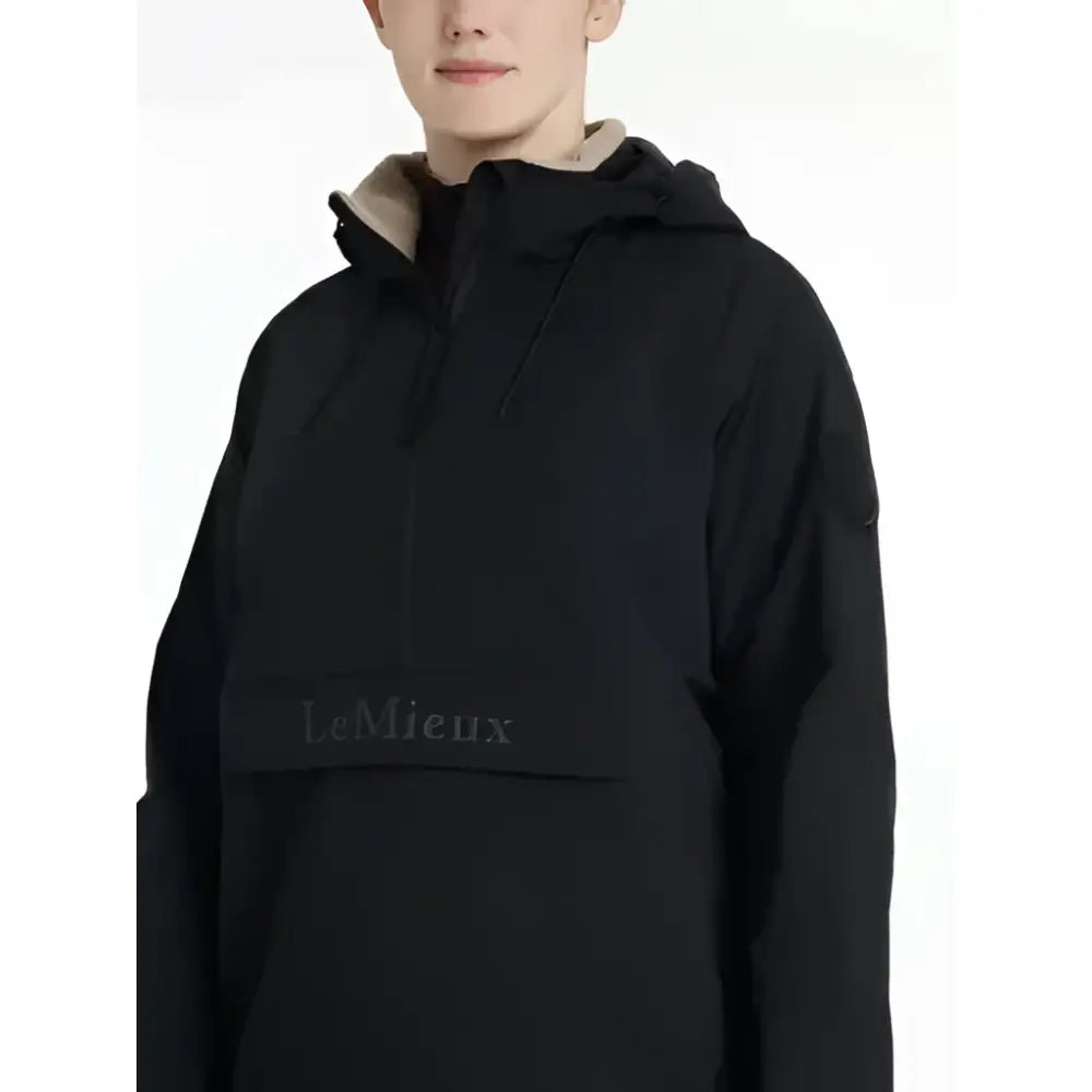 Black lemieux phoebe half zip waterproof anorak with beige lining and gray brand name on front pocket
