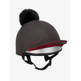Dark gray lemieux pippa hat silk cinder with silky smooth four-way stretch, black faux fur pom-pom, red trim, and silver glitter lining