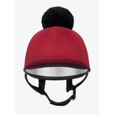 Red lemieux pippa hat silk ember with a black faux fur pom-pom and silver reflective trim for equestrian use