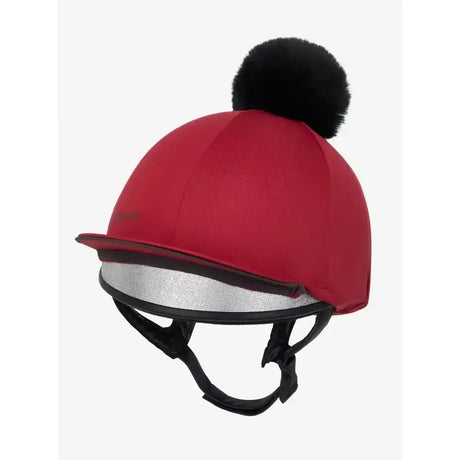 Red lemieux pippa hat silk ember with black faux fur pom pom and silver reflective trim on the brim