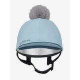 Light blue lemieux pippa hat silk equestrian helmet cover with gray faux fur pom-pom and silver reflective lining
