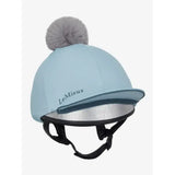 Light blue lemieux pippa hat silk glacier with gray faux fur pom pom and silver reflective lining in silky smooth four way fabric