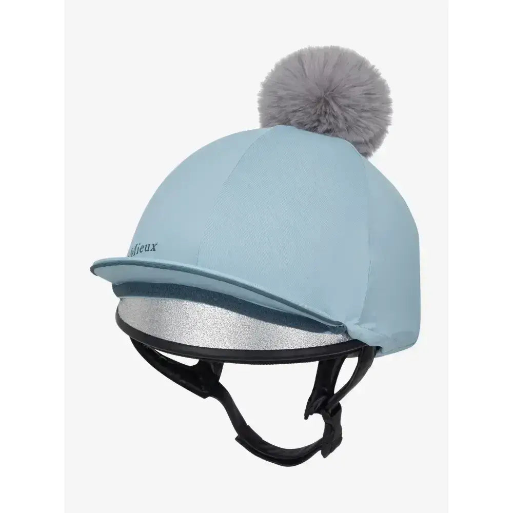 Light blue lemieux pippa hat silk glacier cover with gray pom pom silver reflective trim and silky smooth four way fabric