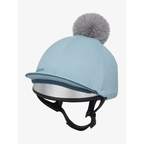 Light blue lemieux pippa hat silk glacier cover with gray pom pom silver reflective trim and silky smooth four way fabric