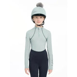 Light green lemieux pippa hat silk long-sleeved equestrian top with black zipper and silky smooth four-way fabric