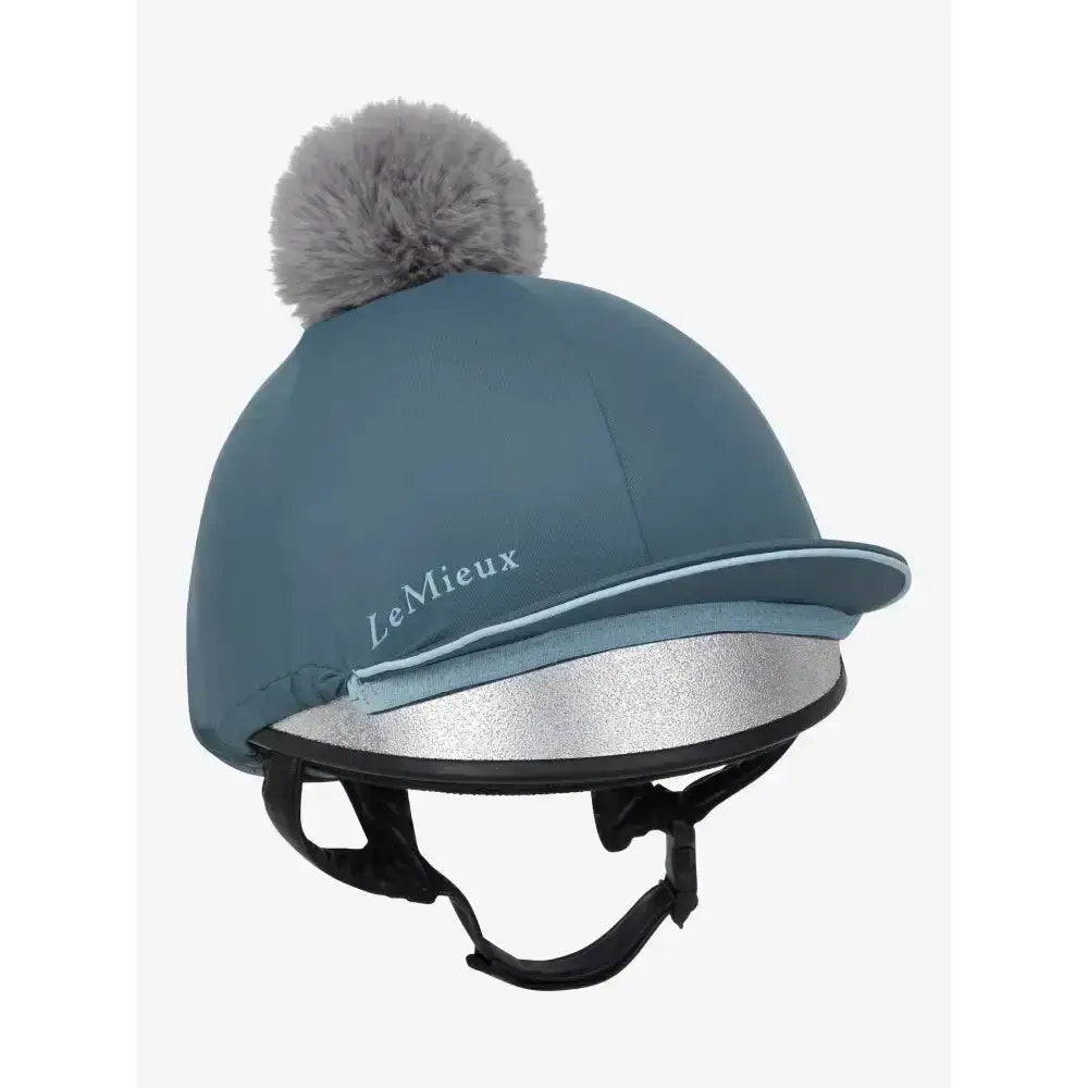 Teal lemieux pippa hat silk petrol with silver reflective band and gray faux fur pom-pom made of silky smooth four-way fabric