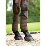 Brown wraparound lemieux polo bandages alpine with blue velcro strap and silver logo tag for polo protection