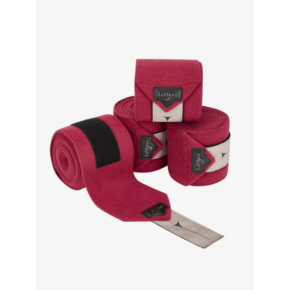 Set of pink Lemieux Polo Bandages Ember for stylish horse leg support