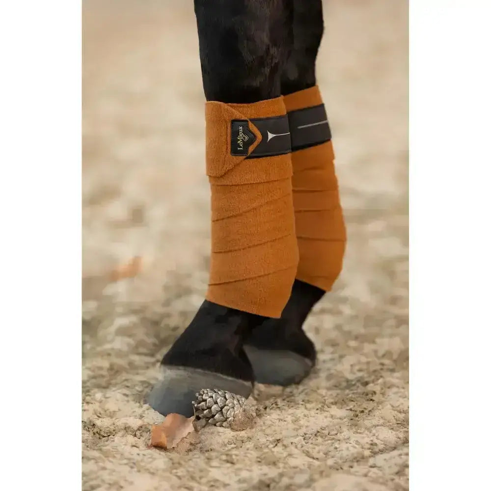 Tan lelytex lemieux polo bandages with black elastic bands and branded patch in polo bandages ginger color
