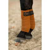 Tan lelytex lemieux polo bandages with black elastic bands and branded patch in polo bandages ginger color
