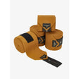 Tan suede lemieux polo bandages ginger with black accents and lemieux branding for horse leg support