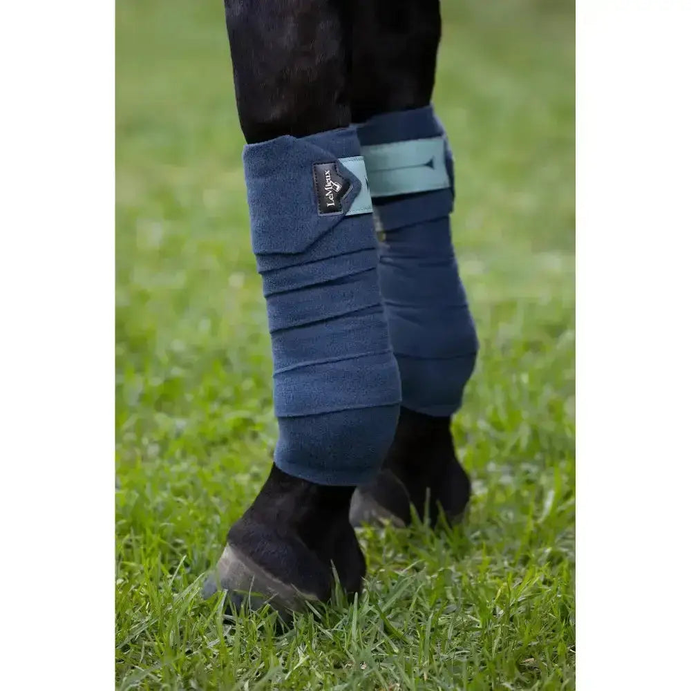 Navy blue fleece lemieux polo bandages with light teal strap and black leather brand patch in polo bandages petrol style