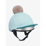 Light blue lemieux pom hat silk aqua lagoon equestrian helmet cover with fluffy beige pom pom and silver trim