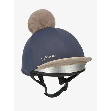 Navy blue lemieux pom hat equestrian helmet cover with beige faux fur pom pom and silver metallic trim silk dusk almond