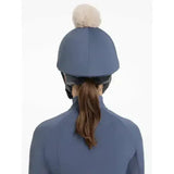 Blue equestrian lemieux pom hat silk dusk mimosa featuring a beige pom-pom on top for stylish riding gear
