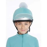 A lemieux pom hat silk lagoon aqua jockey helmet in light blue with silver visor and fluffy white pom-pom on top