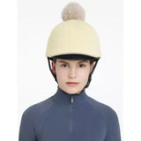 Cream-colored lemieux pom hat fleece helmet cover with a fluffy beige pom-pom in silk mimosa stone color