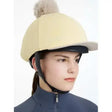 Cream-colored felt lemieux pom hat riding helmet cover with fluffy beige pom pom in silk mimosa stone color