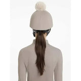 Beige lemieux pom hat equestrian helmet with a fluffy cream pom pom in silk pecan stone color