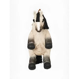 A lemieux pony bag dream plush horse backpack with white and black gradient soft fabric in a playful seated pose