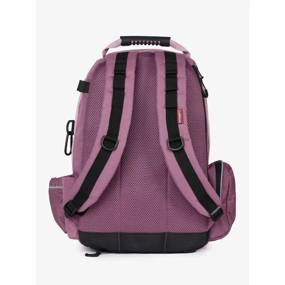 Purple mesh lemieux pro rucksack with black straps, top handle, riding hat holder, and whip loop for easy carry