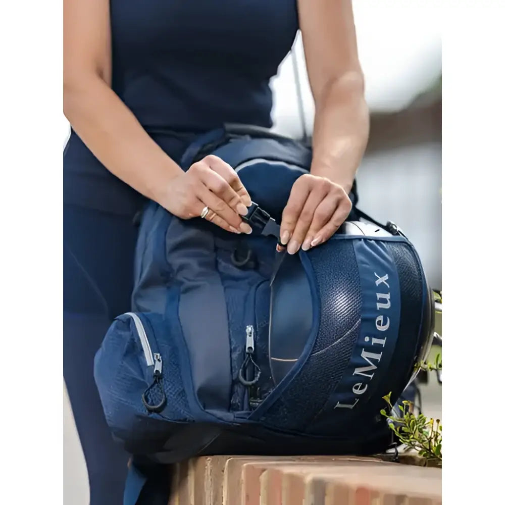 Navy lemieux pro rucksack backpack with mesh side panel and zippered compartments perfect for a tuck-away riding hat