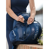 Navy lemieux pro rucksack backpack with mesh side panel and zippered compartments perfect for a tuck-away riding hat