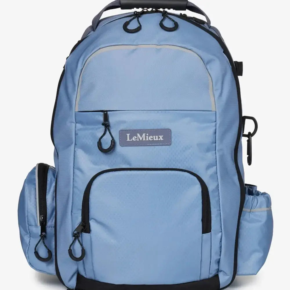 Light blue lemieux pro rucksack powder blue with black trim multiple pockets and hat holder for easy storage