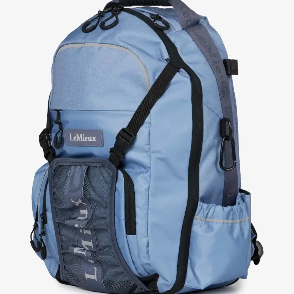 Light blue lemieux pro rucksack with black straps mesh side pocket and hat holder in rucksack powder blue model