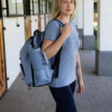 Light blue lemieux pro rucksack with black straps and side hat holder perfect for everyday use