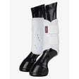 White lemieux proshell brushing boots with black glossy hoof caps for ultimate leg protection in brushing boots white