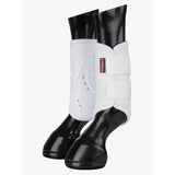 White lemieux proshell brushing boots with black glossy hoof caps for ultimate leg protection in brushing boots white