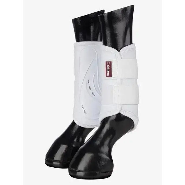 White lemieux proshell brushing boots with black glossy hoof caps for ultimate leg protection in brushing boots white
