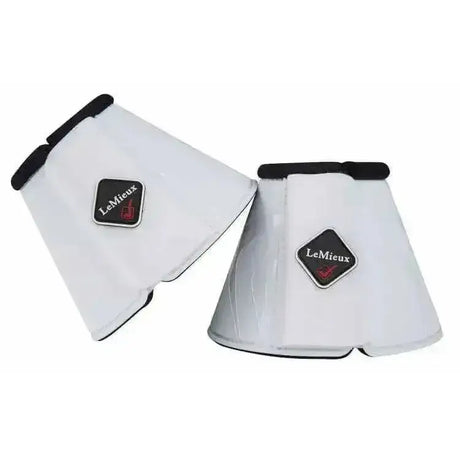 White lemieux proshell flexible reach boots with black trim and diamond logo patch for horse protection