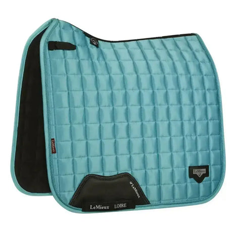 Teal quilted lemieux prosport loire classic dressage square azure saddle pad with black trim and branding