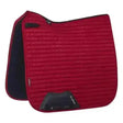 Red quilted lemieux prosport suede dressage square chilli saddle pad with black trim and branded logo patch