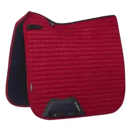 Red quilted lemieux prosport suede dressage square chilli saddle pad with black trim and branded logo patch
