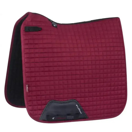 Maroon quilted lemieux prosport suede dressage square mulberry saddle pad with black trim and branded logo patch